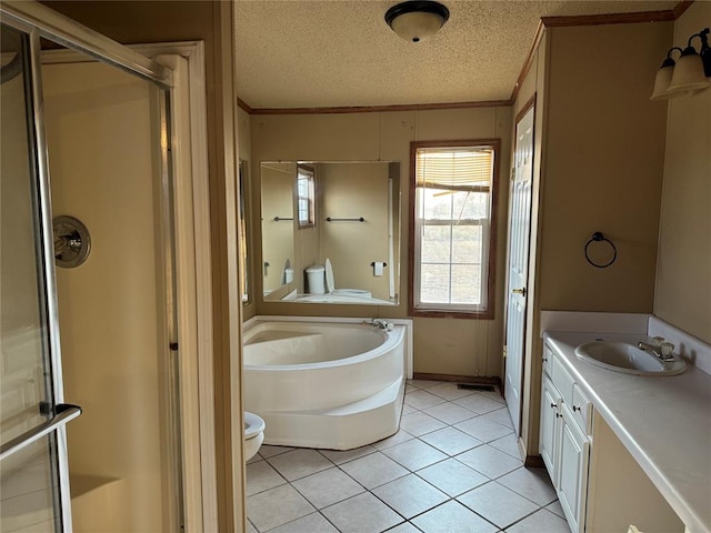 full bathroom with vanity, tile patterned flooring, toilet, a textured ceiling, and independent shower and bath