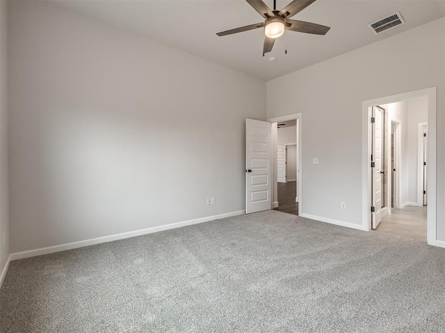 unfurnished bedroom featuring light carpet and ceiling fan