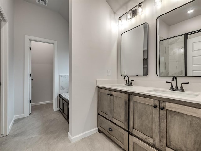 bathroom with vanity, vaulted ceiling, and plus walk in shower