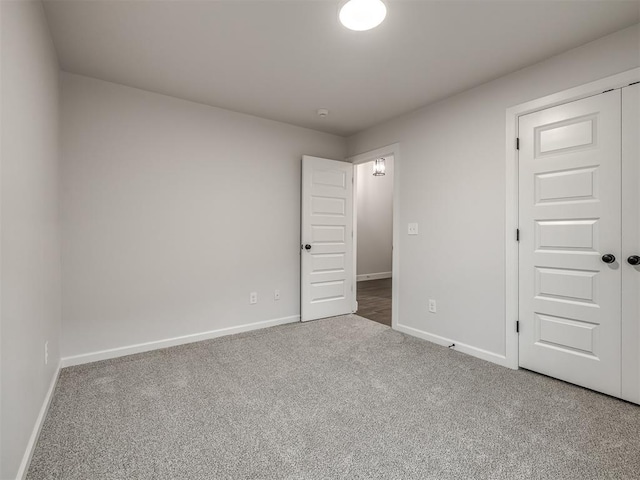 unfurnished bedroom with a closet and carpet