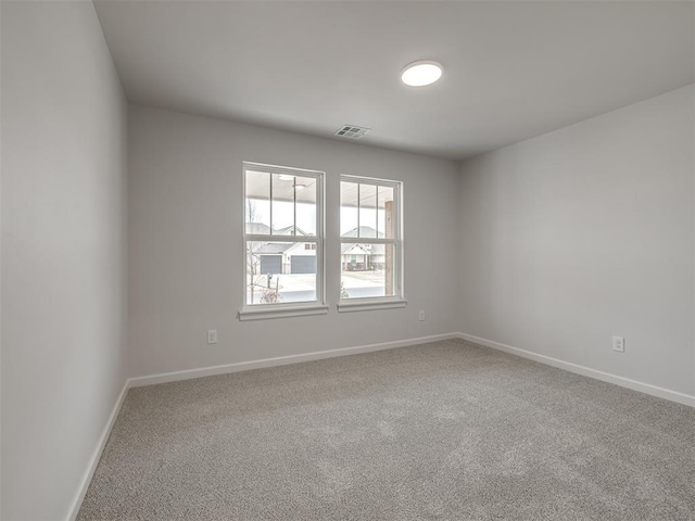 view of carpeted spare room