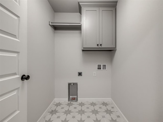 laundry area featuring electric dryer hookup, washer hookup, and cabinets