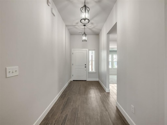 doorway to outside featuring dark hardwood / wood-style flooring