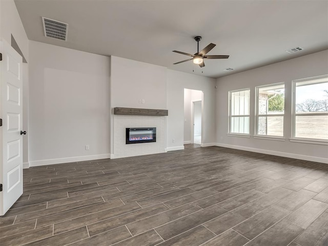 unfurnished living room featuring ceiling fan