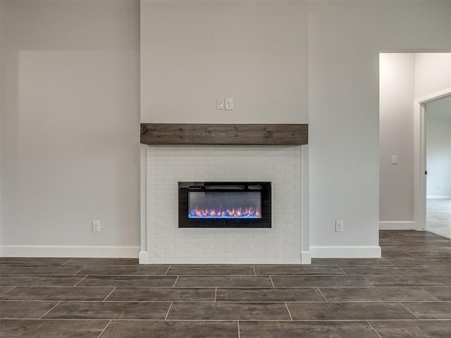 interior details with a brick fireplace