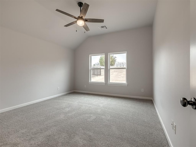 carpeted empty room with lofted ceiling and ceiling fan