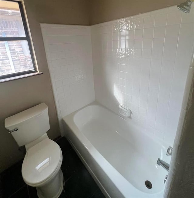 bathroom with tile patterned floors and toilet