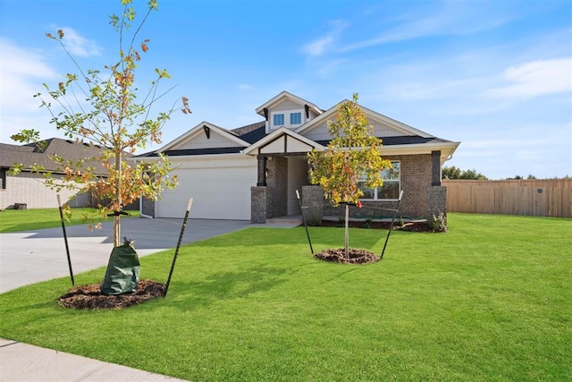 view of front of house featuring a front yard and a garage