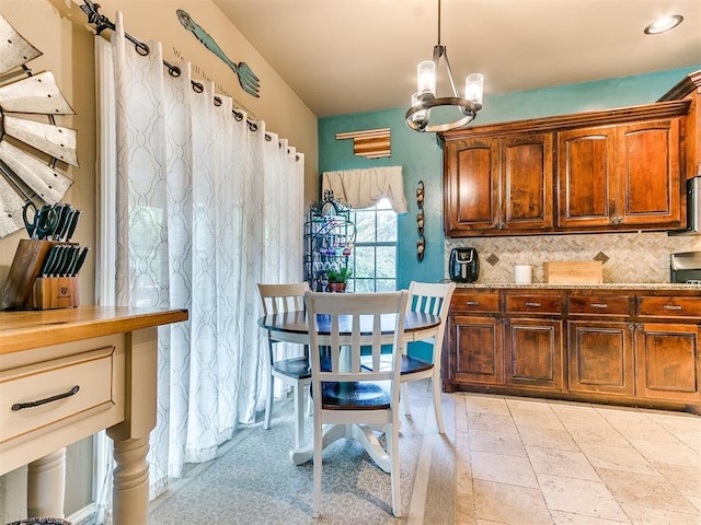 3393 Creek View Ct, Newcastle, OK 73065 - kitchen with a chandelier, backsplash, pendant lighting, and light stone counters