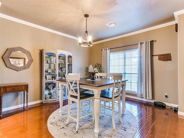 3393 Creek View Ct, Newcastle, OK 73065 - dining area with baseboards, a chandelier, wood-type flooring, and ornamental molding