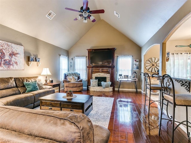 3393 Creek View Ct, Newcastle, OK 73065 - living area with a ceiling fan, arched walkways, lofted ceiling, hardwood / wood-style flooring, and a fireplace