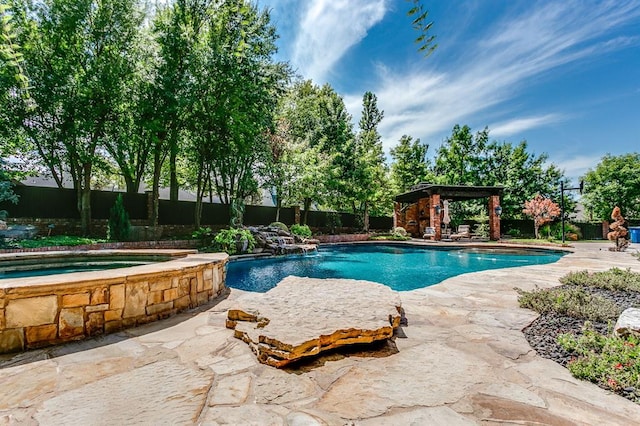 view of pool featuring an in ground hot tub and a gazebo