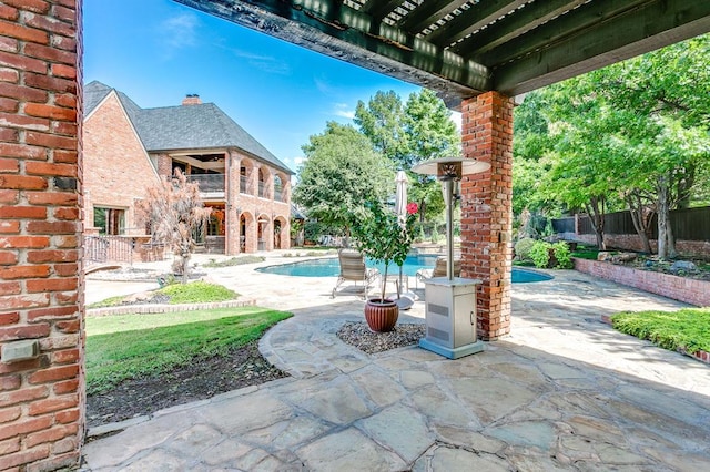 view of patio with a fenced in pool and a pergola