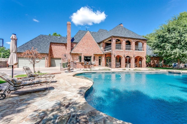 view of pool featuring a patio area