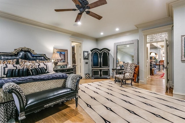 bedroom with ornamental molding and light wood-type flooring