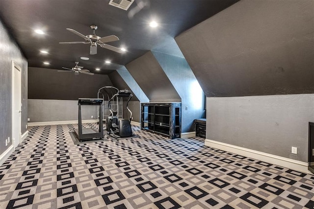 exercise room with vaulted ceiling