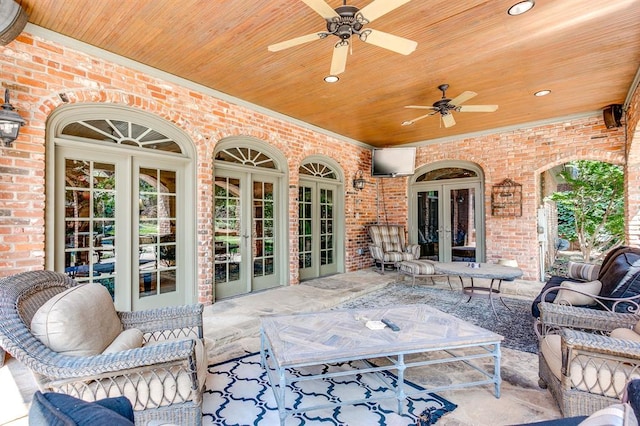 view of patio / terrace with an outdoor hangout area, french doors, and ceiling fan