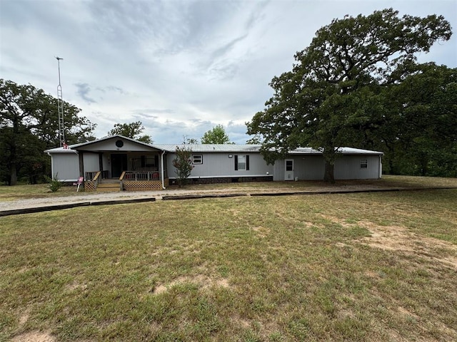 view of front facade with covered porch and a front yard