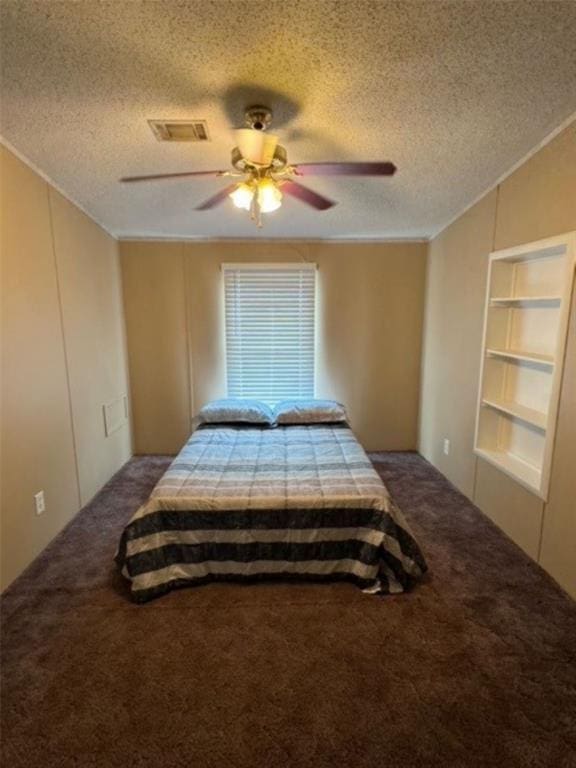 carpeted bedroom with ceiling fan, crown molding, and a textured ceiling