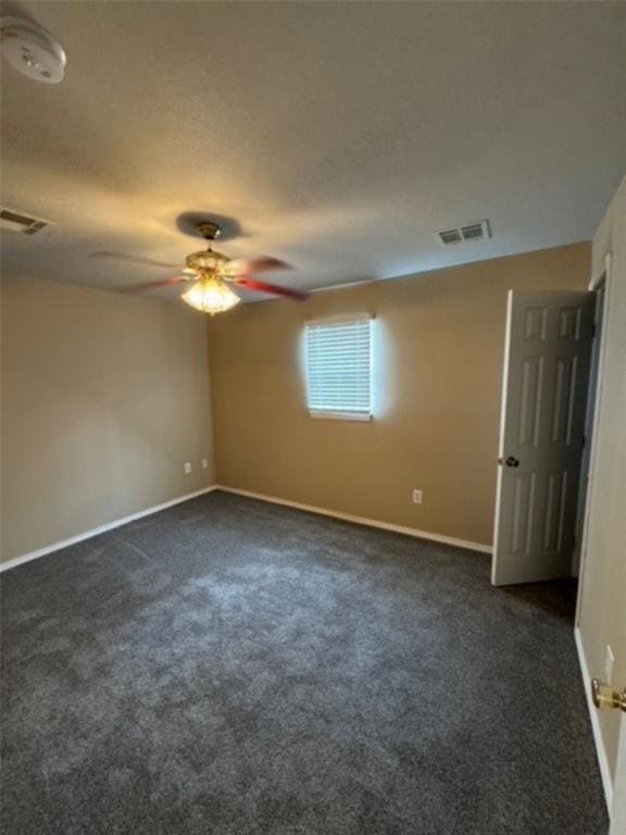 carpeted empty room with ceiling fan