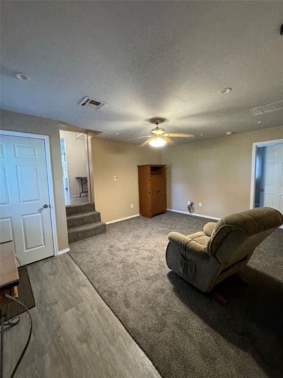 living room with carpet and ceiling fan