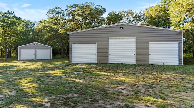 garage featuring a lawn