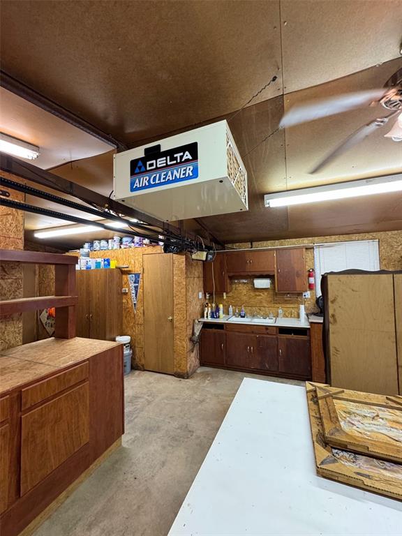 miscellaneous room featuring ceiling fan