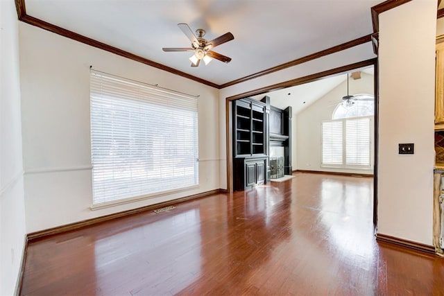 unfurnished living room featuring ceiling fan, crown molding, wood-type flooring, and lofted ceiling