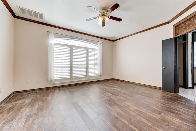 unfurnished room featuring hardwood / wood-style floors, ceiling fan, and ornamental molding