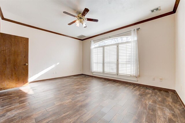 spare room with dark hardwood / wood-style flooring, ceiling fan, and ornamental molding