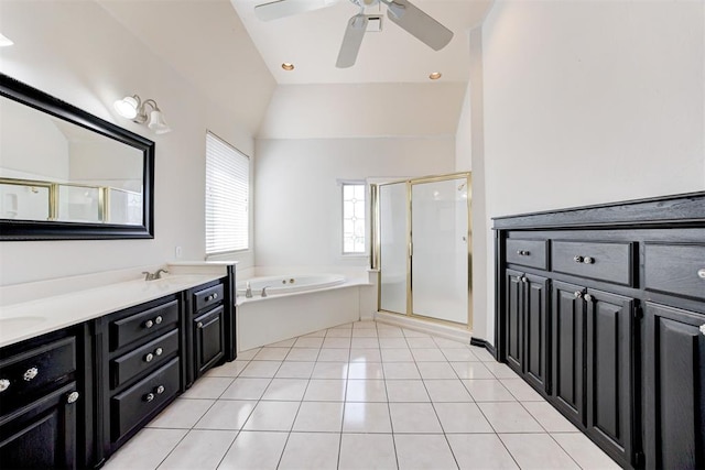 bathroom featuring ceiling fan, plus walk in shower, tile patterned floors, vaulted ceiling, and vanity