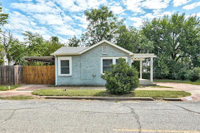 view of home's exterior with a carport