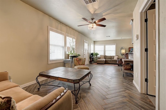 living room with parquet flooring and ceiling fan