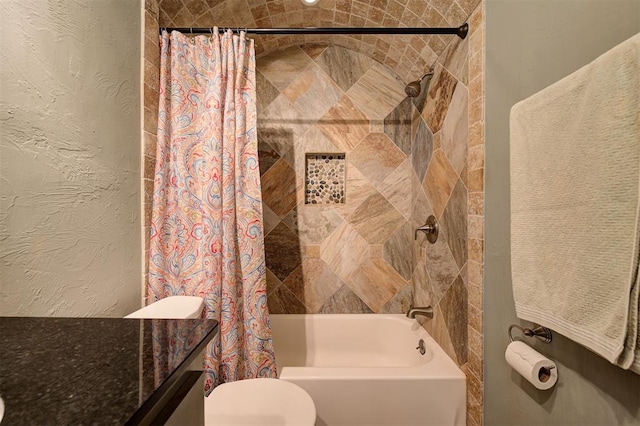 bathroom featuring toilet and shower / tub combo