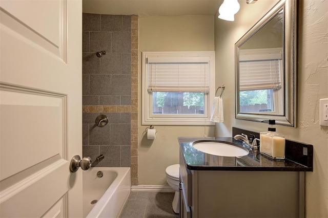 full bathroom with vanity, toilet, and tiled shower / bath combo