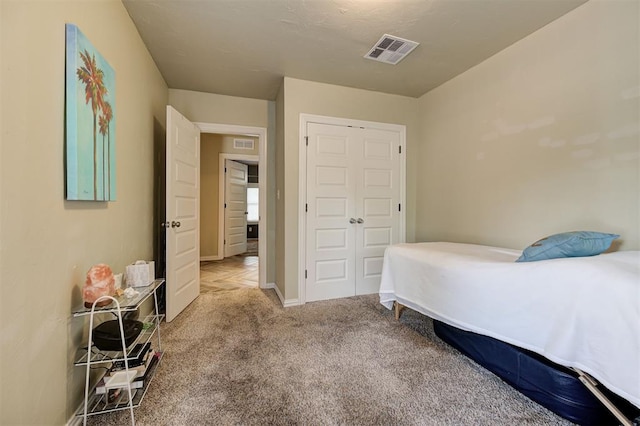 bedroom with a closet and carpet