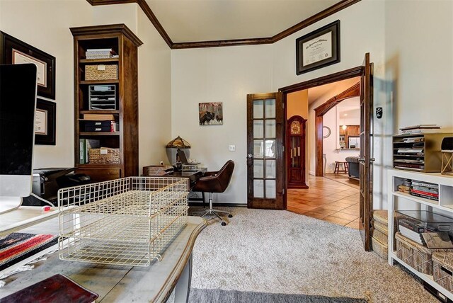 carpeted home office with crown molding and french doors