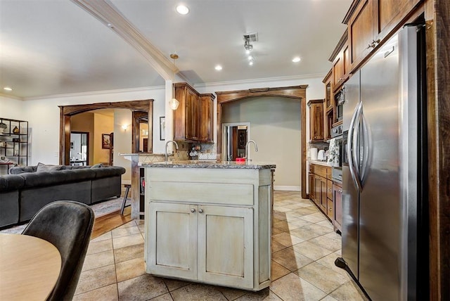 kitchen featuring decorative backsplash, light stone counters, ornamental molding, and appliances with stainless steel finishes