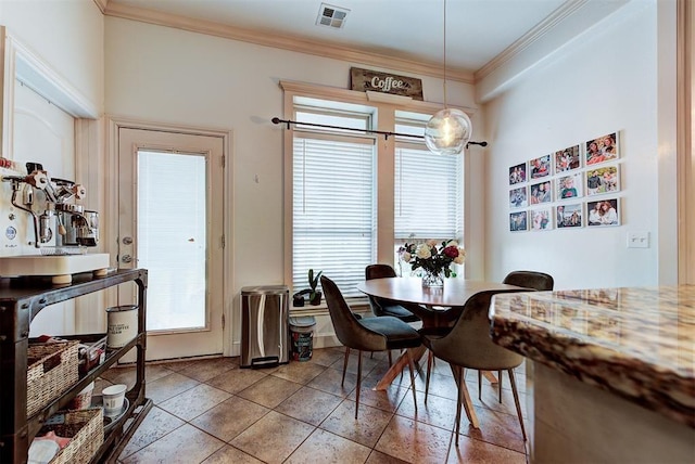 tiled dining space with ornamental molding