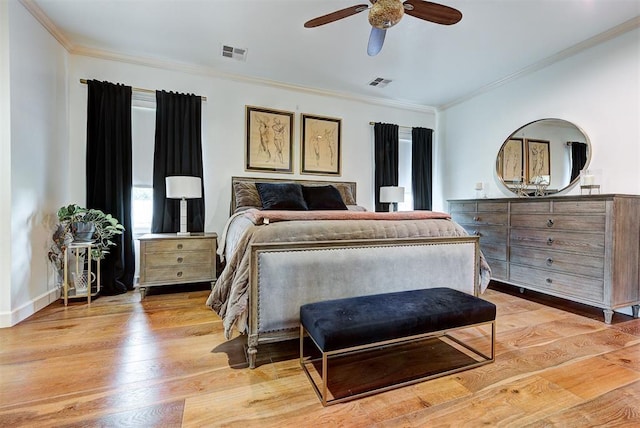 bedroom with ceiling fan, light hardwood / wood-style floors, and ornamental molding