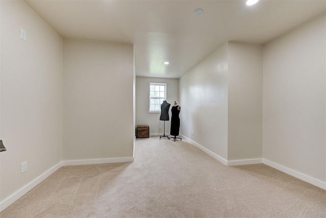 interior space featuring light colored carpet