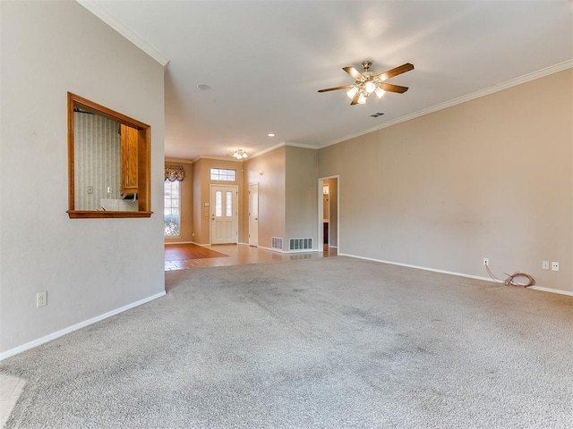 unfurnished living room with light carpet, ceiling fan, and ornamental molding