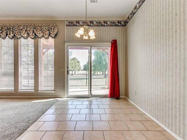 doorway to outside with tile patterned flooring, crown molding, and an inviting chandelier