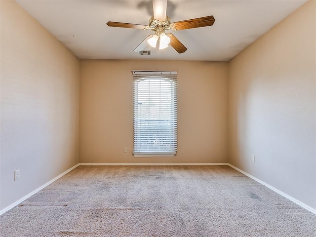 carpeted empty room with ceiling fan