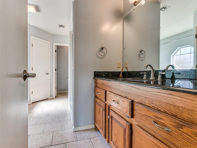 bathroom with vanity and tile patterned floors