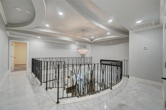 hallway featuring a chandelier