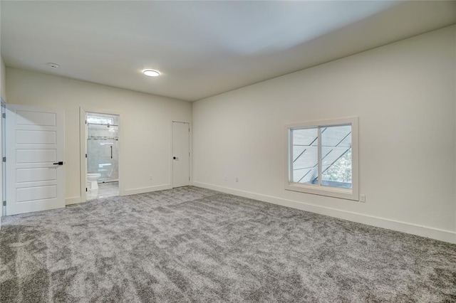 empty room featuring carpet flooring