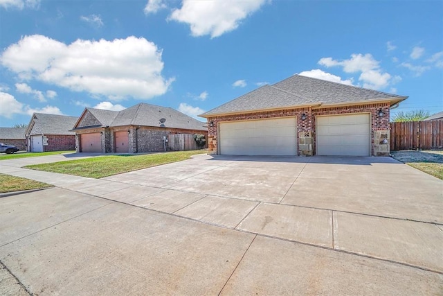 view of front facade featuring a garage and a front lawn