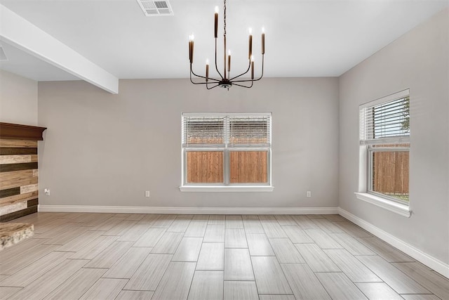 unfurnished dining area featuring a chandelier and light wood-type flooring