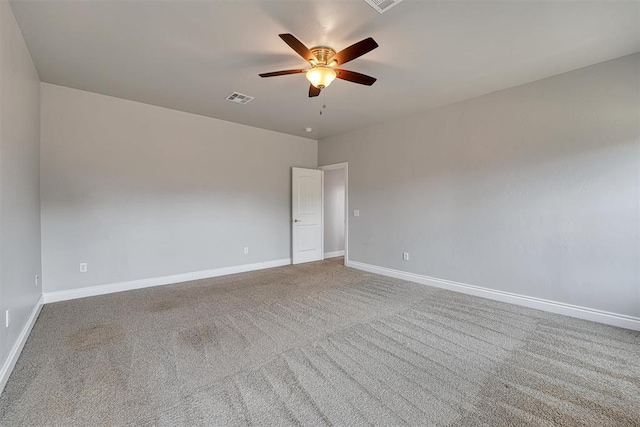 spare room featuring carpet flooring and ceiling fan